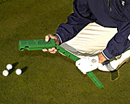 Greens SpeedReader extending from stowed position to measure golf green speeds